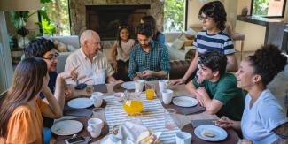 family sitting down have a meal